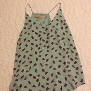 Light blue tank top with maroon accents